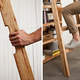 Illustration for article titled A Secret Pop-Out Ladder Ensures Nothing Is Ever Out of Reach On This Extra-Tall Shelf